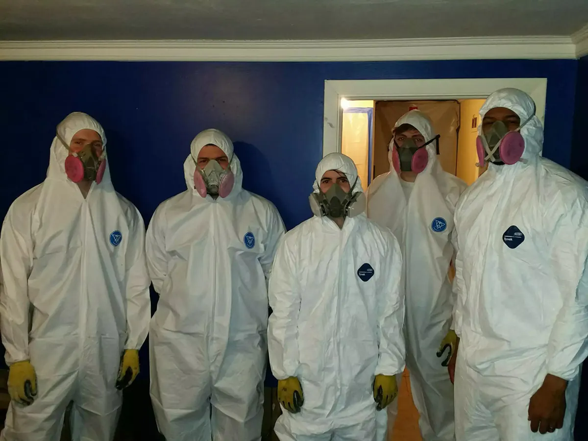 Rapid Clean Restoration crew in protective equipment ready for emergency water damage response